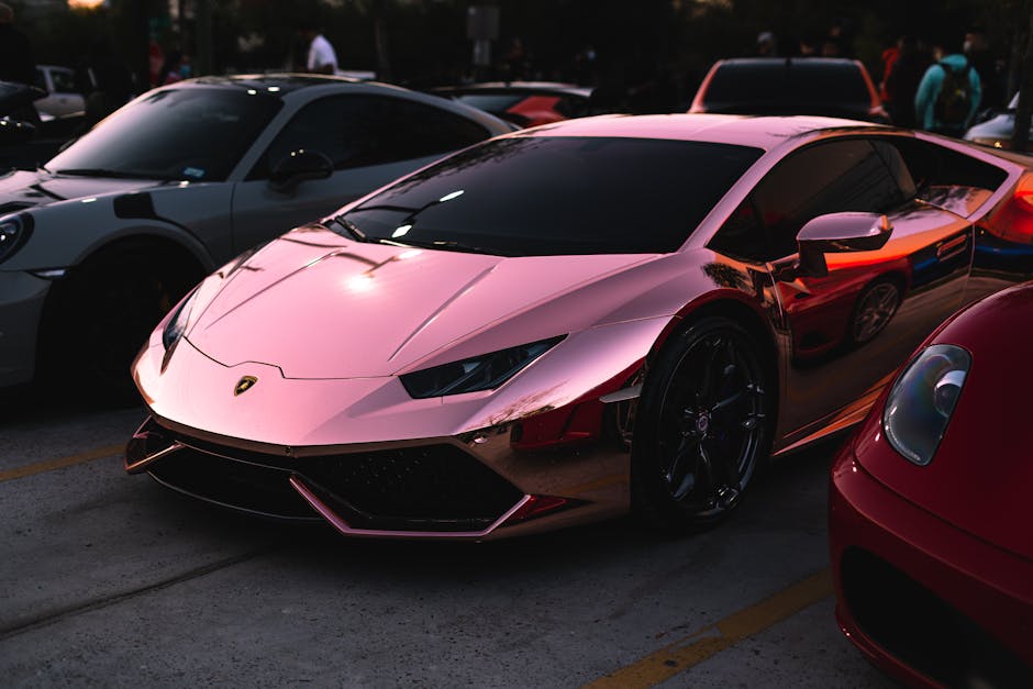 Sleek rose gold Lamborghini shining at an outdoor car show